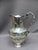 Baluster ewer and its basin in silver plated metal decorated with rocaille cartouche and moved frieze. Note that the ewer...