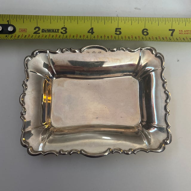 Small silver plate tray with scalloped edges. Used as a jewelry dish on the nightstand for rings and earrings. In good...