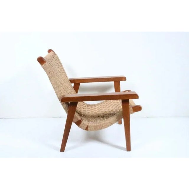 Mexican Modern Michael van Beuren teak and woven raffia lounge chair. Featuring a sturdy, functional, with comfortable two...