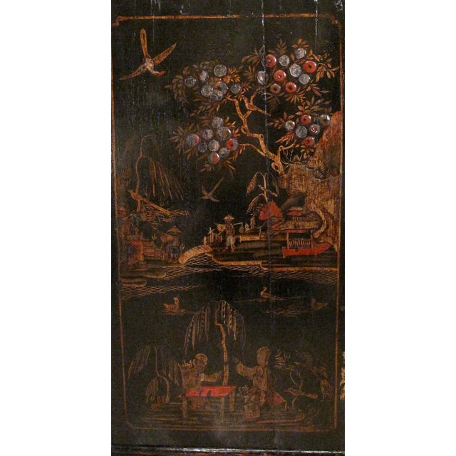 A charming George II period English corner cabinet, ca. 1740-1760, with a shaped crest, finely decorated with gilt and...