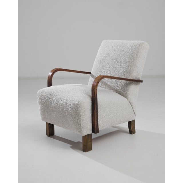 Enhance your living space with this sophisticated 1960s Czech Upholstered Armchair by the renowned Jindřich Halabala....