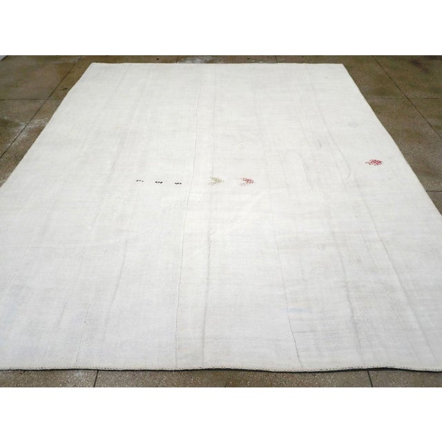 A Vintage Flatweave Kilim room size carpet handmade during the Mid-20th century. Measures: 11' 10" x 14' 1"