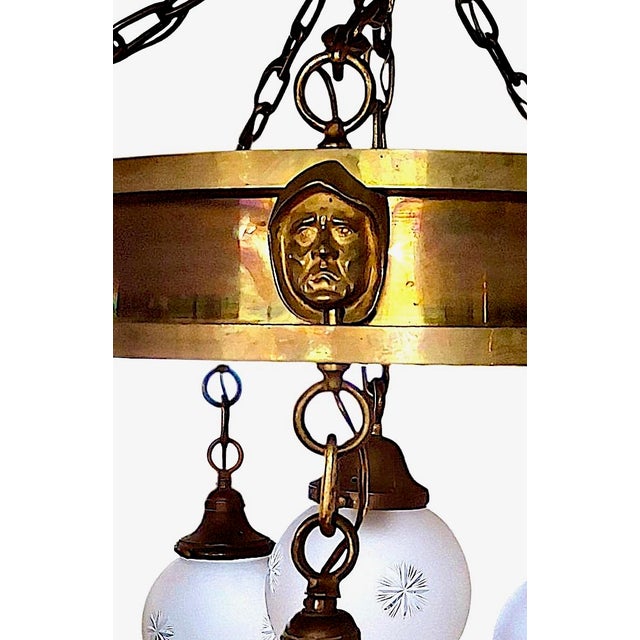 Offered here is an antique Arts & Crafts, Gothic, or Renaissance Revival-style, solid brass "pan" chandelier supporting...
