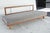 The original conical legs have been replaced with square-shaped beechwood ones.The original wedge-shaped back cushion is...