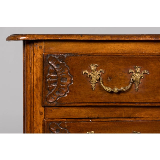 An exceptional early 18th-century French Régence period walnut chest of drawers, sourced in Lyon, France. Dating to the...