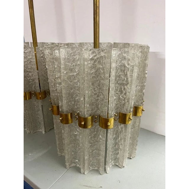 Pair of Large Crystal Orrefors Chandeliers attributed to Carl Fagerlund. Perfect for above a dining table. These are large...