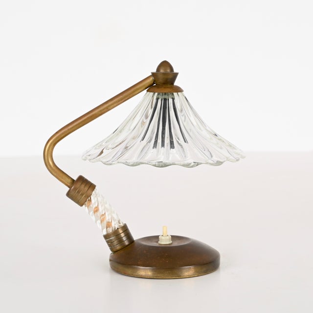Gorgeous table lamp made in a combination murano glass and brass. This incredibly elegant lamp was designed by ercole...