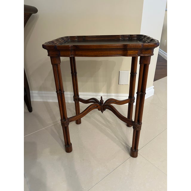 Classic Maitland-Smith small side/drinks table. Wood with leather embossed top.