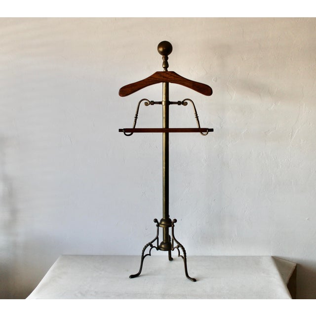 Wood Brass Valet Stand. Wood appears to be oak, sphere at top is for a hat, the trouser bar can be height adjusted, sturdy...