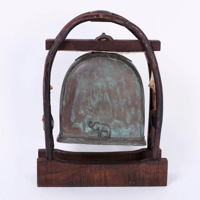 Elephant bell and clapper that rings with a deep rich tone and cast in bronze. Having acquired a verdigris patina and...