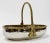 Stunning vintage decorative bowl made of heavy hammered silver metal with a brass rope detail framing the top. Handle is...