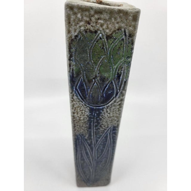 This enameled stoneware soliflore vase, designed by the talented Jean Claude Monange in the 1970s, represents a perfect...