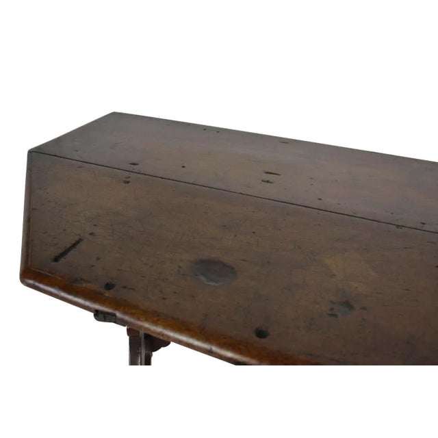 A really nice rustic French console table with 18th-century origins. Handmade iron stretchers. Great patina to the wood....