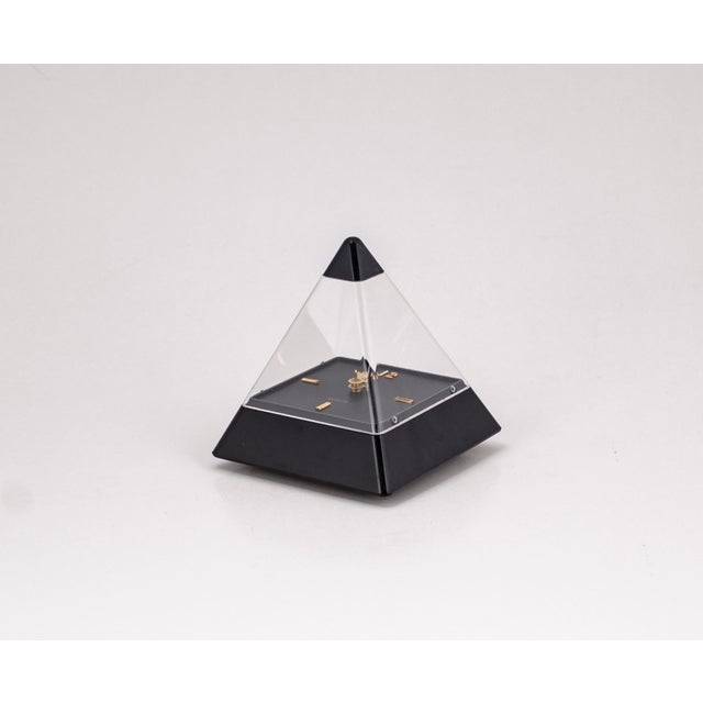 This postmodern pyramid clock, in its original 1989 packaging, designed by Hidekatsu Nomizu for Tochigi Tokei, is typical...