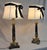 A beautiful vintage circa 1950s French empire neoclassical style marble and gilt bronze pair of table lamps styled with...