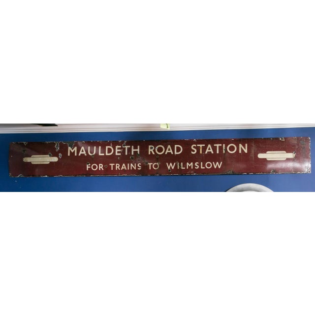 Vintage porcelain enameled, painted sign from the Mauldeth railway station which opened in 1909. This station serves the...