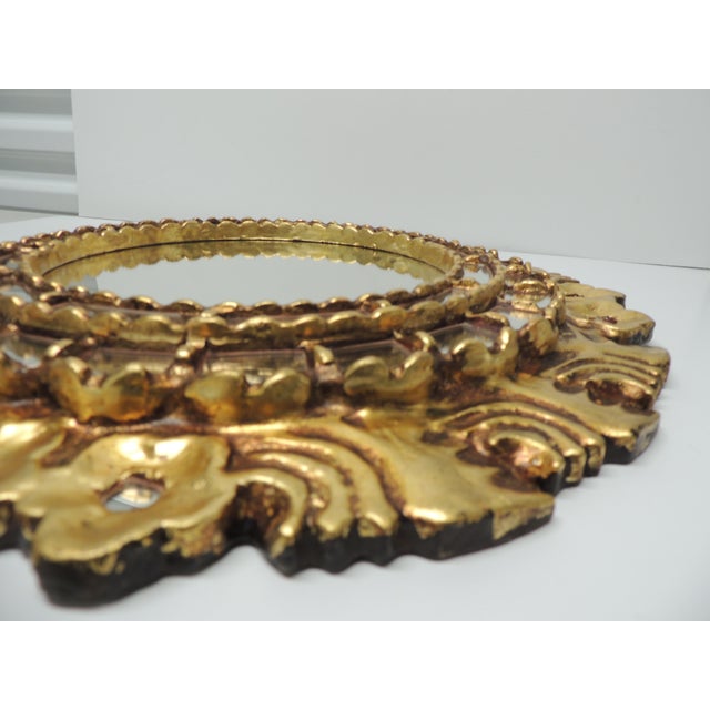 Vintage Wood Round Mirror with Gold-leaf Finish From Peru. Hand-carved Hanging wire in the back. Size: 18"D x 2"D