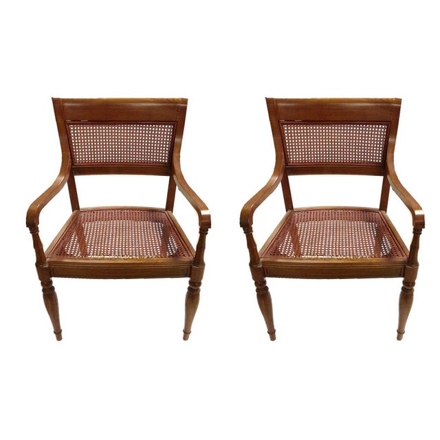 Vintage Seating armchair with woven rattan and wood back. Woven rattan bottom and tapering legs. One chair seat has...