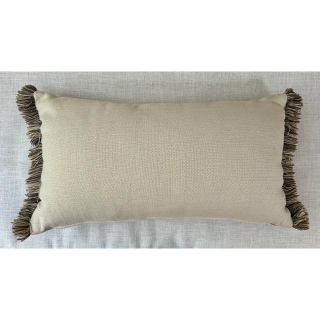 Light chocolate brown faux leather backed by linen color fabric that matches the stripe on the front with ‘buckle’ detail...