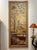 An 18th century French trumeau mirror, carved in pine with an inset oil on canvas chinoiserie scene depicting two figures...
