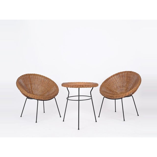 Spectacular French Riviera style set that includes two twin "shell" chairs and a coffee table all made in hand-woven...