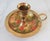 Vintage enameled brass candle holders with holly and berry motif. Made in India. Some age wear to painted finish. Pictured.