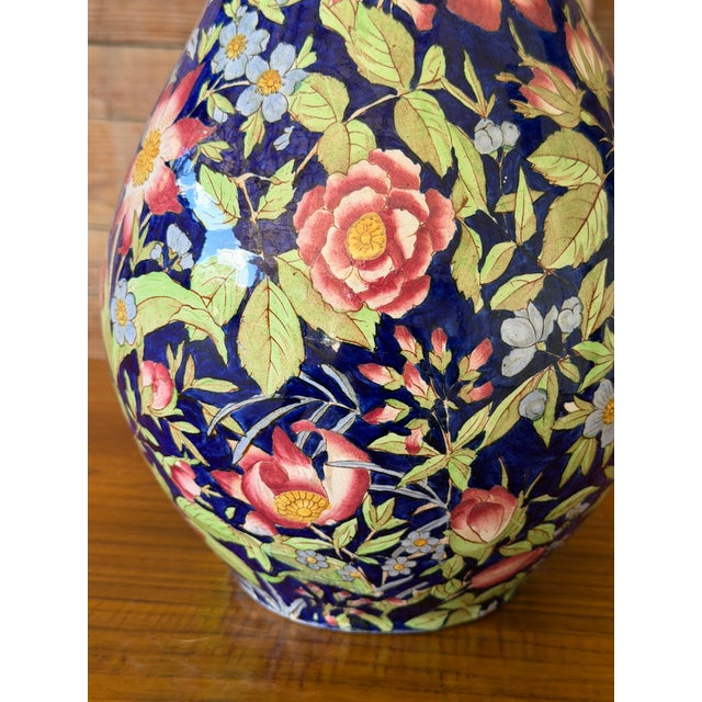 A striking and monumental 18-inch antique Art Nouveau ceramic floor vase featuring an exceptionally dense, all-over...