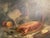 Signed still life oil painting depicting a lobster on a platter, flanked by fruits, a knife, a glass, and an ornate silver...