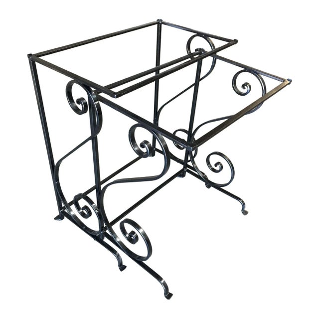 Original 1950s outdoor/patio nesting side table pair with Iron scrolling base. larger table: 20ʺW × 12ʺD × 23ʺH Smaller...