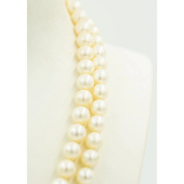 Simply elegant 16" double strand of 8.25mm cultured pearl beads necklace. The pearls are silvery white in color and have a...