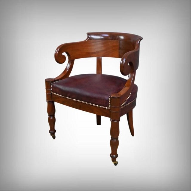 This office chair embodies the understated elegance of the Restoration period. Crafted from mahogany enhanced by its warm...
