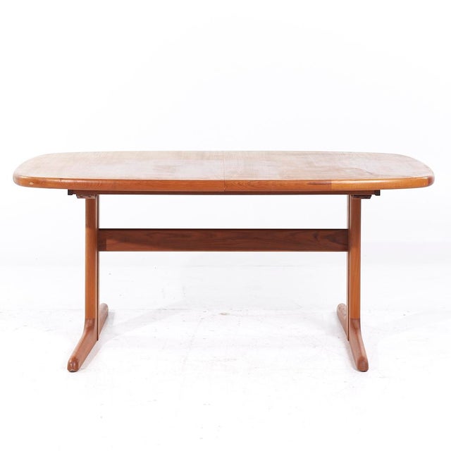 Skovby Mid Century Teak Hidden Leaf Dining Table with 2 Leaves This table measures: 65 wide x 39.5 deep x 28 inches high,...