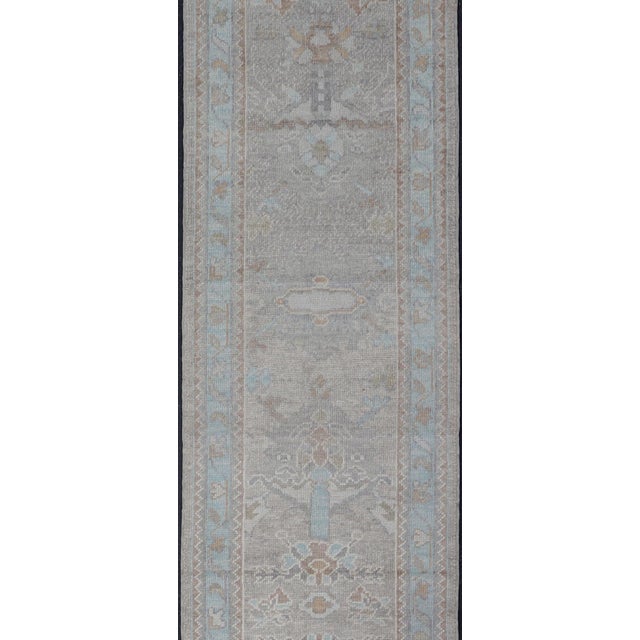 Measures: 2'8 x 14'0 Turkish Oushak Runner in Soft Gray with Light Blue and Taupe 2'8 x 14'0. Keivan Woven Arts. rug...
