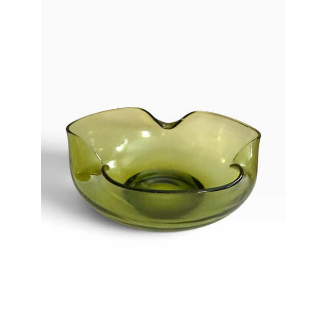 Beautiful vintage olive green glass bowl featuring an organic, freeform silhouette and dramatically undulating scalloped...