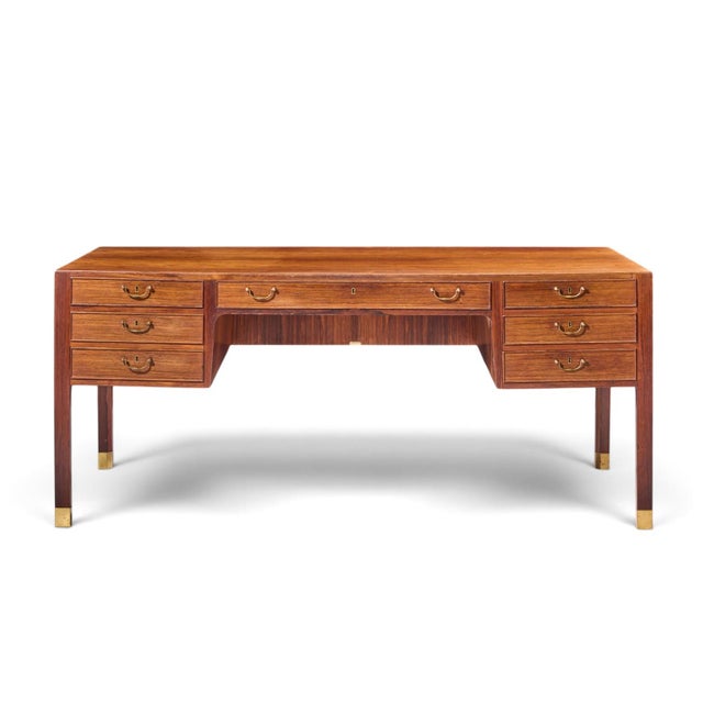 Ole Wanscher for AJ Iversen Mid Century Danish Rosewood and Brass Desk This desk measures: 67 wide x 33.5 deep x 29.25...