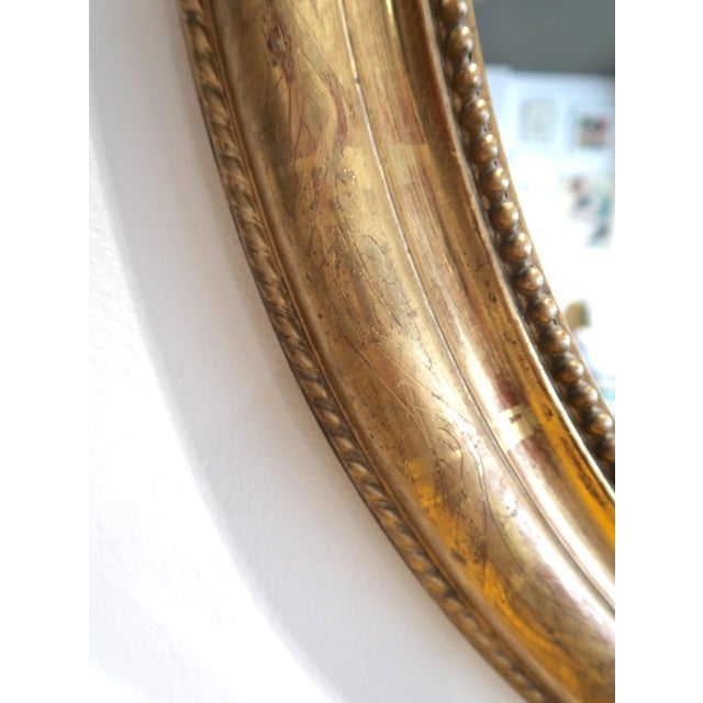 Lovely 19th century gold Louis Philippe mirror. Featuring a bar pattern and a beaded inner border. Circa 1880.