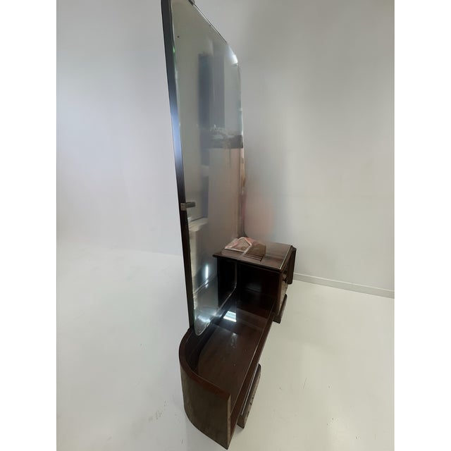 Elegant Art Deco dressing table produced in Germany in the late 1940s to early 1950s. The piece reflects the transition...