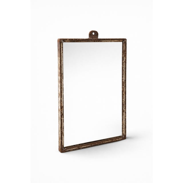 This authentic mid-century industrial wall mirror features a beautifully weathered metal frame with original distressed...