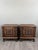 An elegant pair of small solid wood side tables dating from the early 20th century. Each piece features a front adorned...