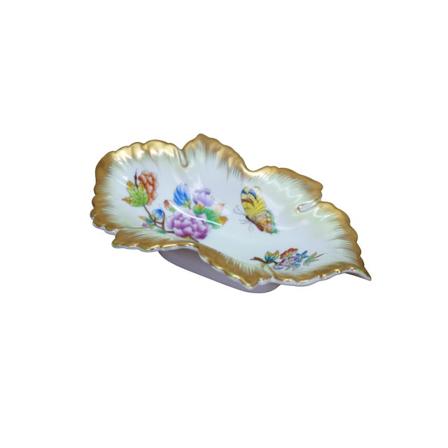 This authentic Herend Hungary fine porcelain dish is sculpted in the elegant shape of twin overlapping leaves, featuring...