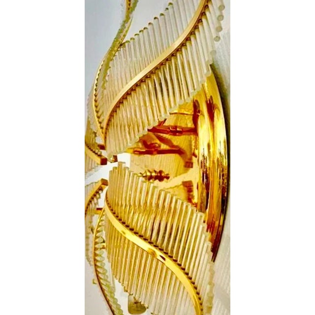 Exceptional palm wall lighting with tube murano glass with gilded gold structure. The design and the quality of the glass...