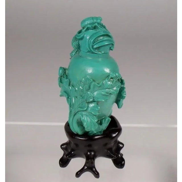 For the collector, a late Qing Dynasty carved turquoise snuff bottle with bok choy and radish along with an ant, cicada,...