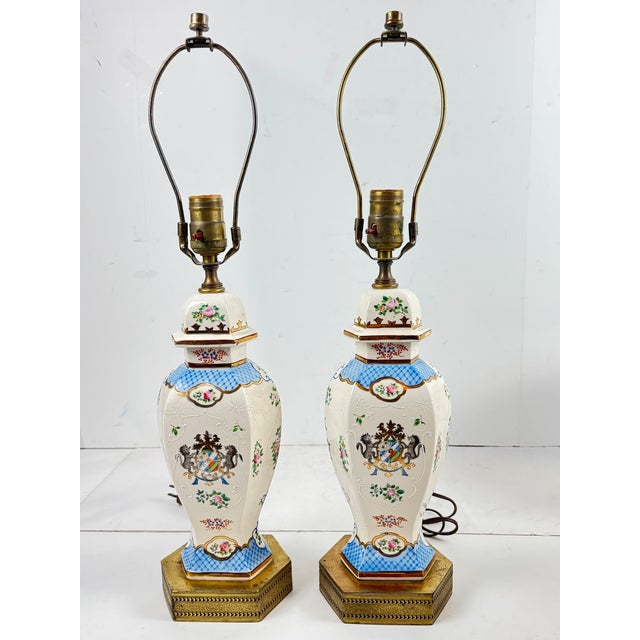 Asian Mid 20th Century Pair of Vintage Hand Painted Porcelain Table Lamps With Lion Crest and Brass Base For Sale - Image 3 of 9