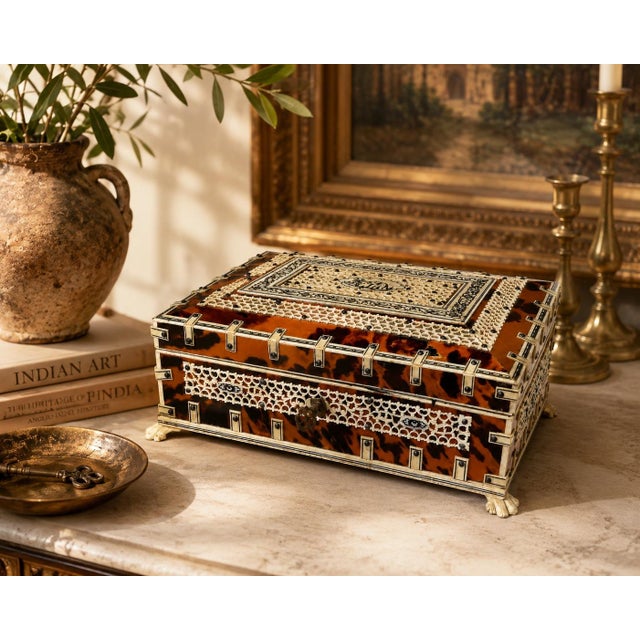19th Century Anglo-Indian Faux Tortoiseshell, Carved Bone and Ebony Inlaid Jewelry Box with Elephant Motif An exceptional...
