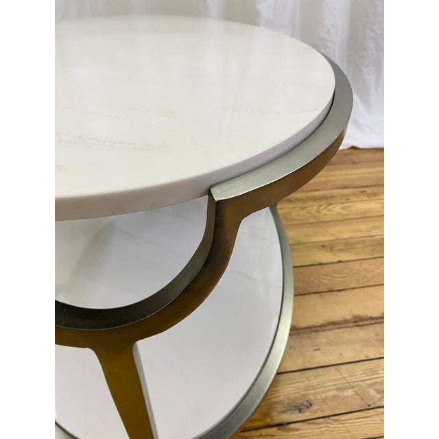 Bernhardt Morello cocktail table featuring a faux Carrara marble top and steel frame in a nickel finish. This oval-shaped...