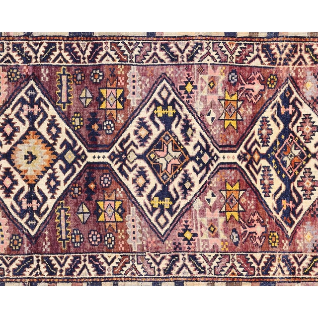 Handwoven vintage Turkish Oushak runner measuring 3'2" x 12'. Crafted with wool on wool foundation in Western Turkey's...