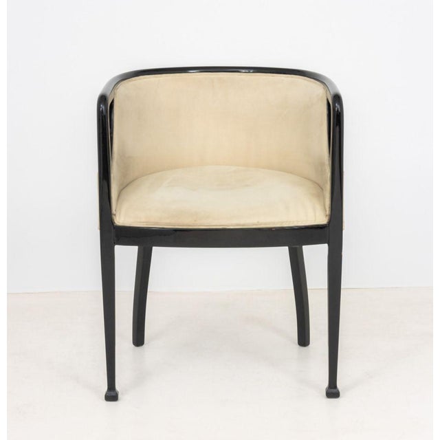 Art Deco Black Lacquered Tub Chair, 1920s, probably Belgian, with beige upholstery. 29" H x 23" W x 21" D. Provenance:...