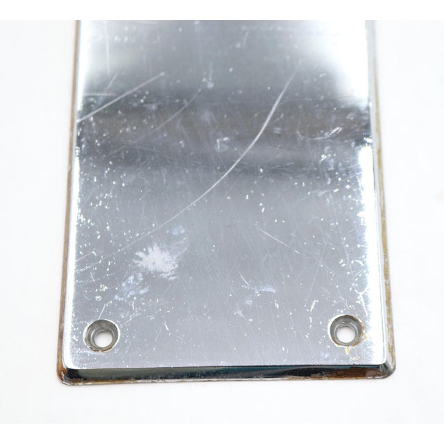 Vintage push plate made of brass with a chrome finish. The original mounting screws are not available. Good condition with...