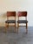 Elegant pair of Danish Modern dining chairs designed by Ib Kofod-Larsen for Christensen & Larsen, produced in Denmark...