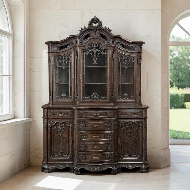 Exceptional 19th century Country French Régence Liégeois china buffet, hand carved from solid oak and distinguished by an...